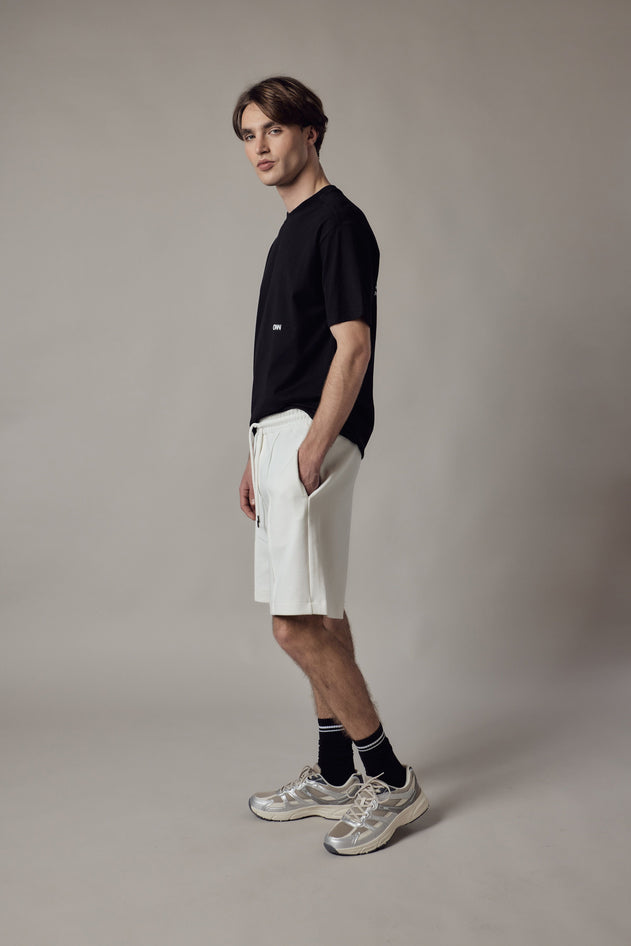 Pantaloncino Loose Fit Interlock-kuosissa