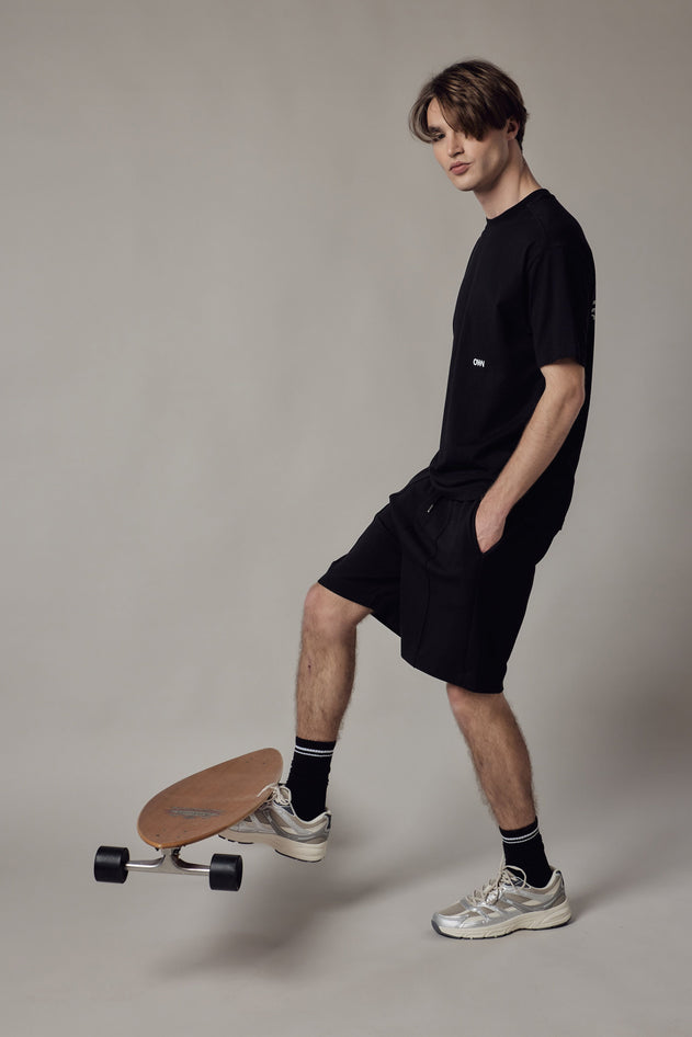 Pantaloncino Loose Fit Interlock-kuosissa