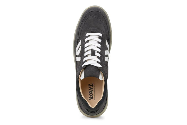 Black sneaker with white laces on a white background