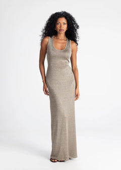 Woman wearing a long beige dress on a white background