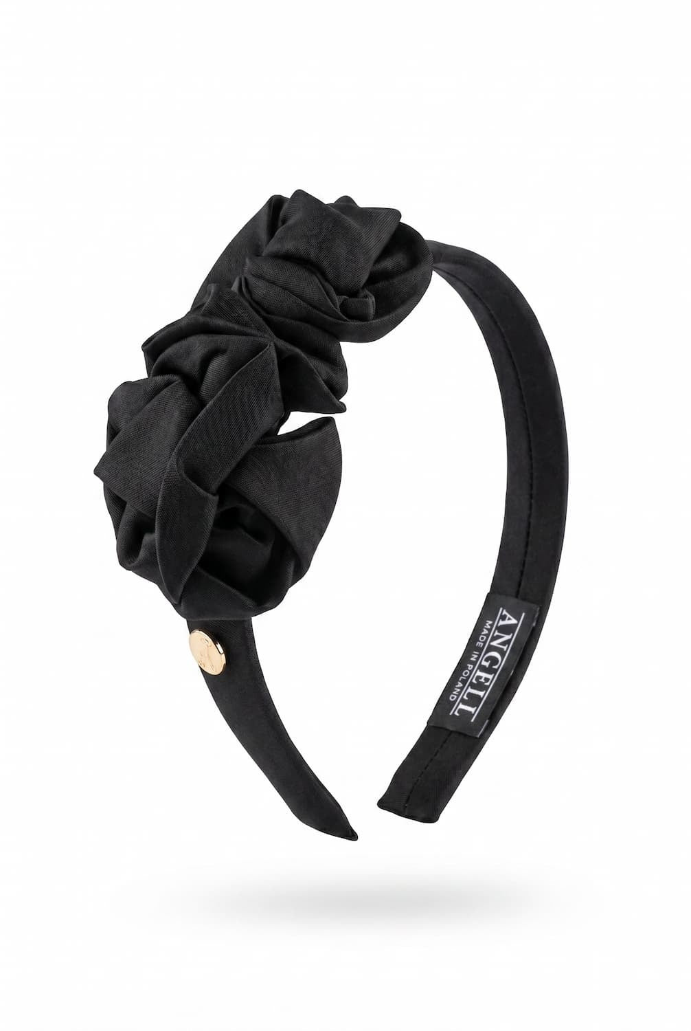 Black headband with floral design on a white background