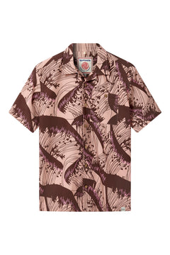 The SPINDRIFT - Organic Cotton Shirt - Pink Wave features short sleeves, a collar, and a bold pink base with brown abstract wave prints. Made from organic cotton, it includes a visible label inside the neck.