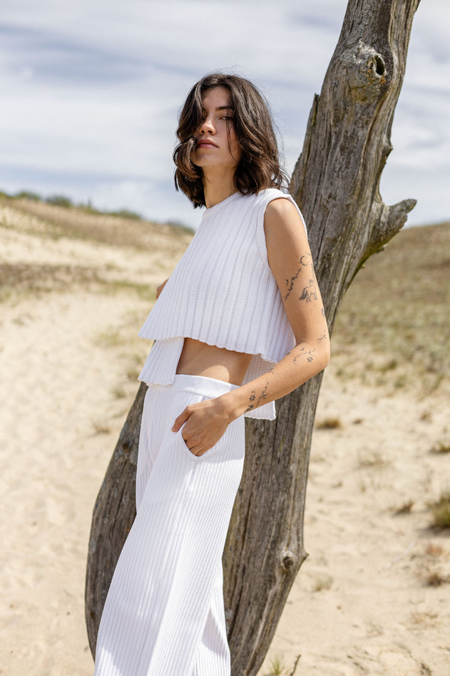 White cotton asymmetric knit top, side view