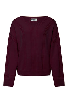 Woman wearing Komodo walnut brown merino wool jumper