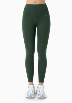 Green leggings worn by a person on a white background