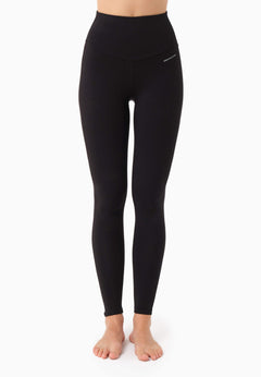 Black leggings worn by a person on a white background