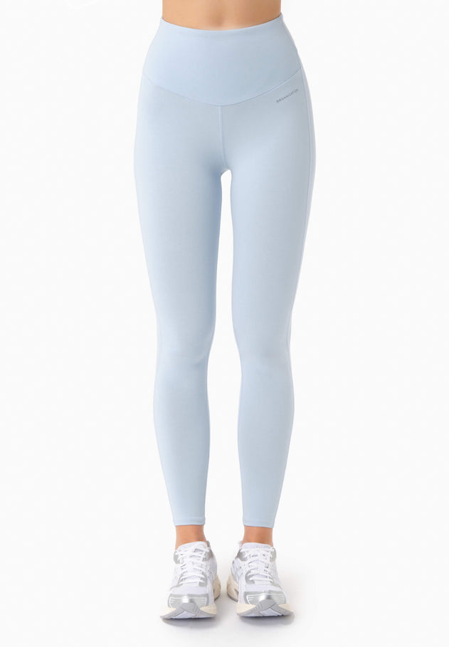 Light blue leggings worn by a person on a white background