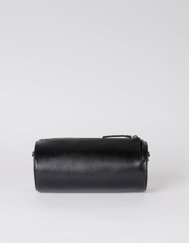 Black cylindrical leather product on a white background