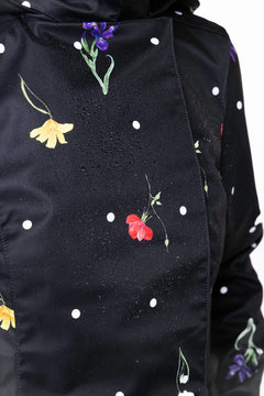 rainsisters-coat-cosmic-meadow-waterproof-black-floral-print-close-up.jpg?v=1779051267