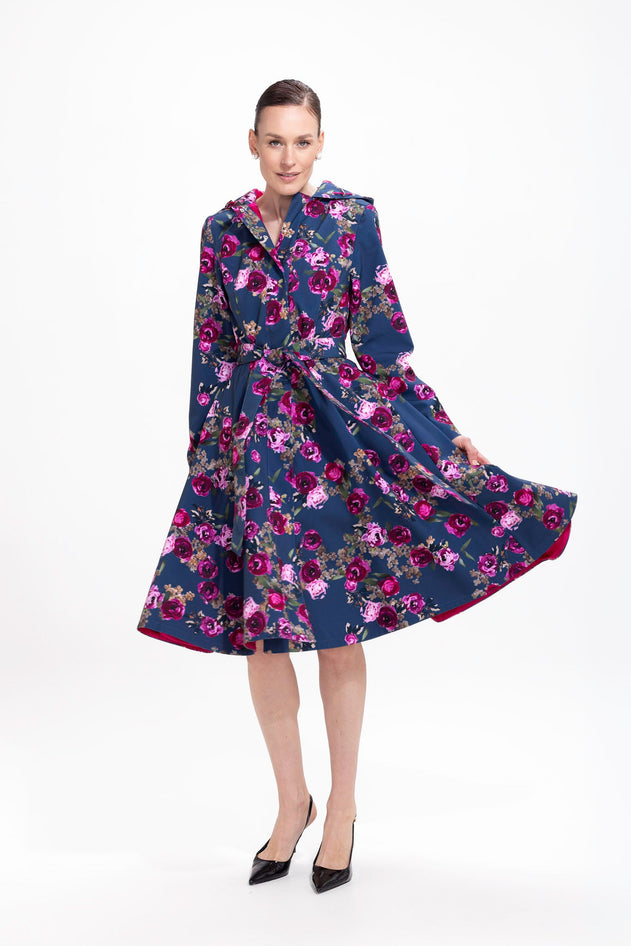 rainsisters-coat-misty-rose-waterproof-blue-floral-in-motion.jpg?v=1779055155