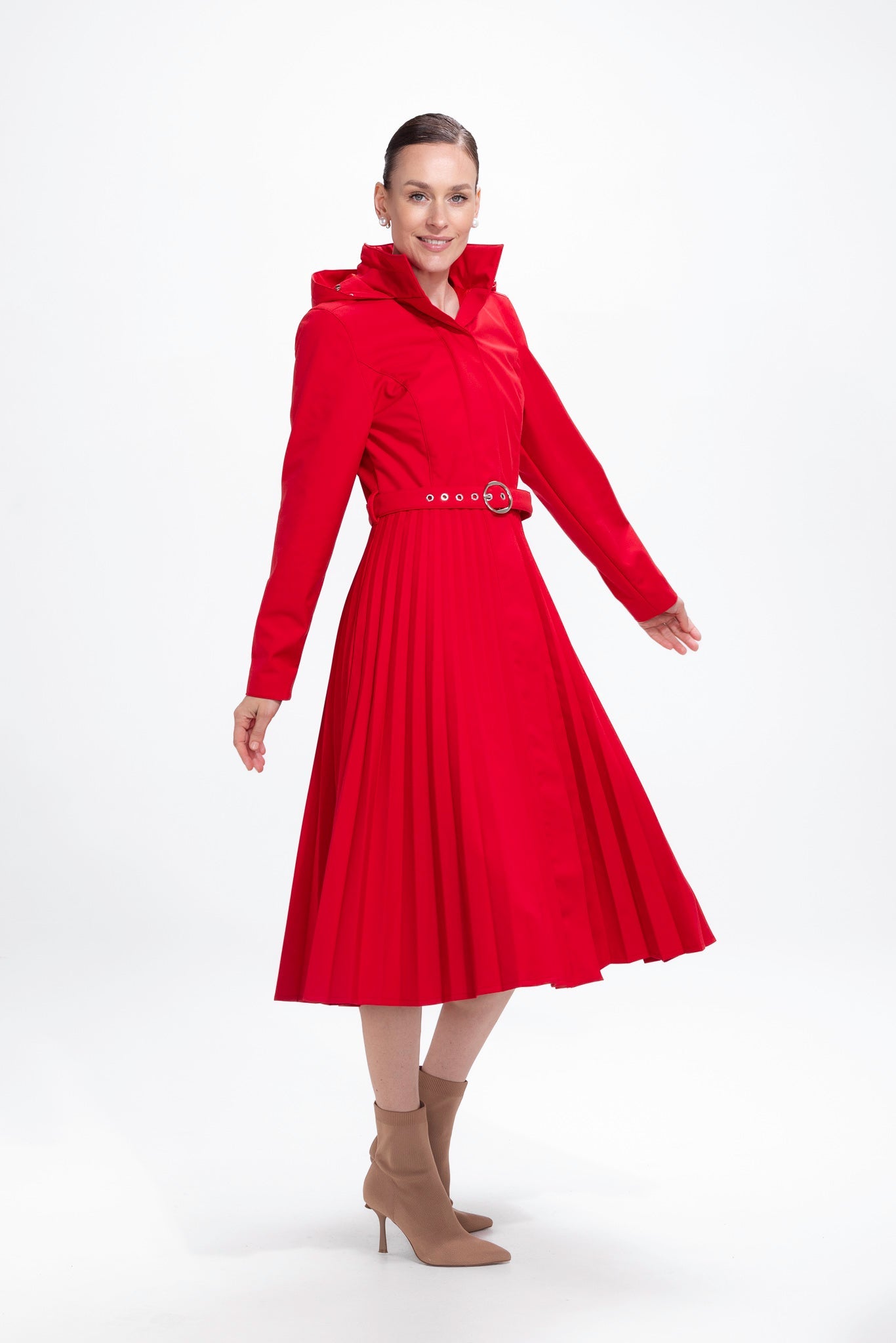 rainsisters-coat-scarlet-waltz-waterproof-red-pleated-in-motion.jpg?v=1779057509