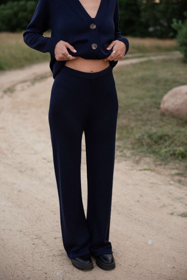 Dark Blue wide-leg merino pants in casual lounge setting